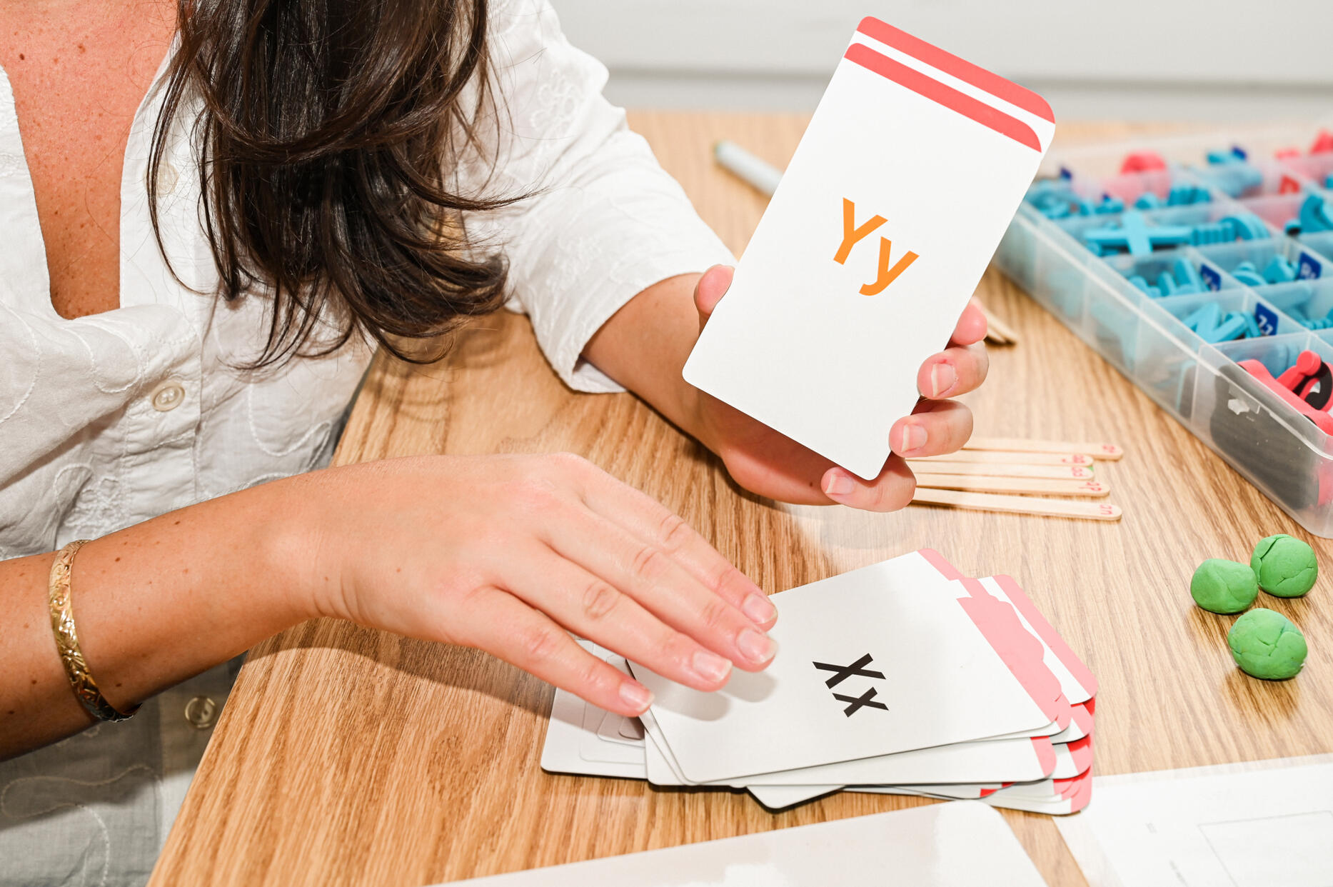 Reading Tutoring Service Playing a learning game with a student to help them read.